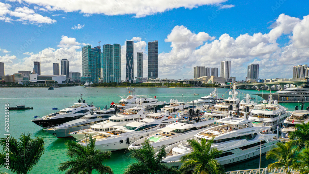Fototapeta premium Aerial Photography of Luxury Boats and Buildings in the Background