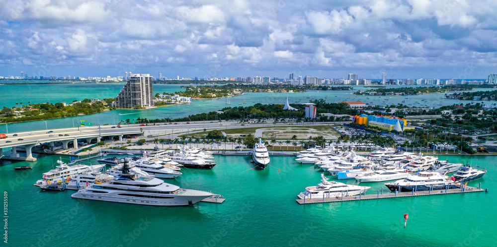 Fototapeta premium Aerial Photography of Luxury Boats and Buildings in the Background