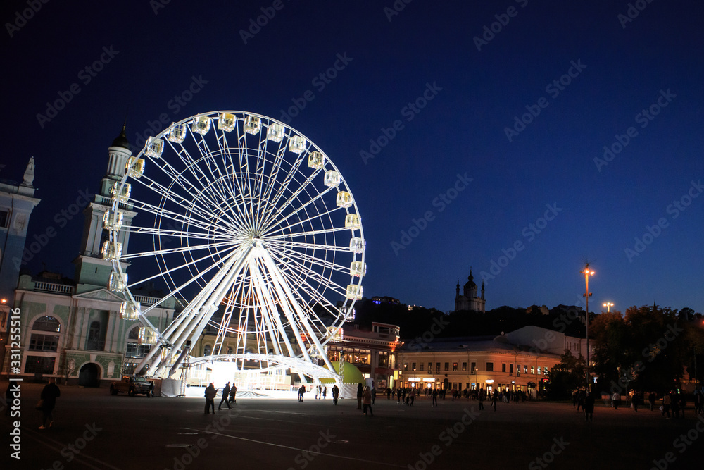 Glowing Ferris Wheel at night