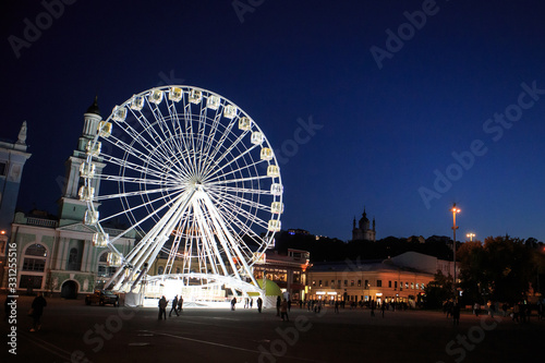 Glowing Ferris Wheel at night