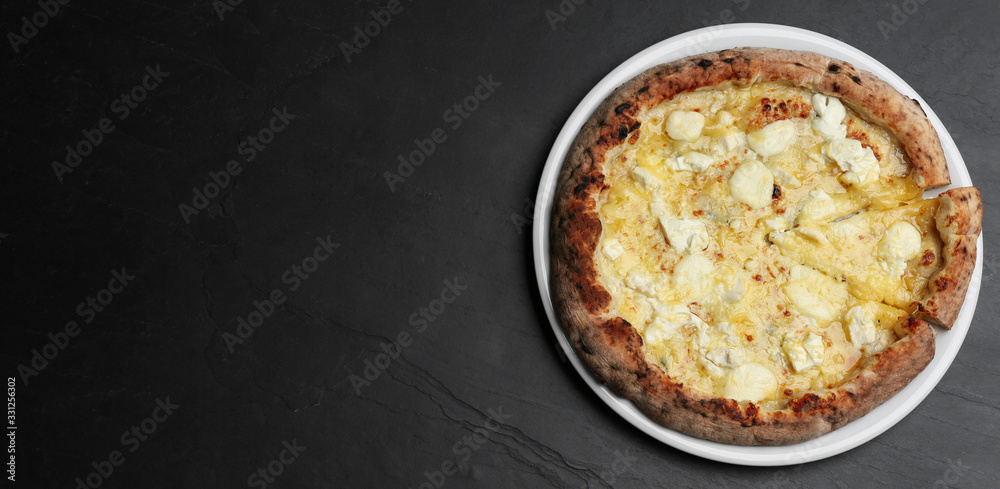 Tasty cheese pizza on black table, top view. Space for text Tasty cheese pizza on black table, top view. Space for text