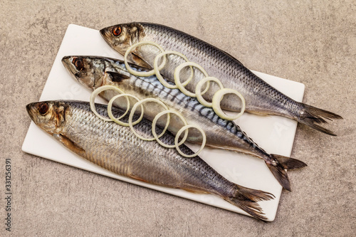 Pickled whole mackerel and herring. Traditional seafood delicacy, healthy eating concept photo