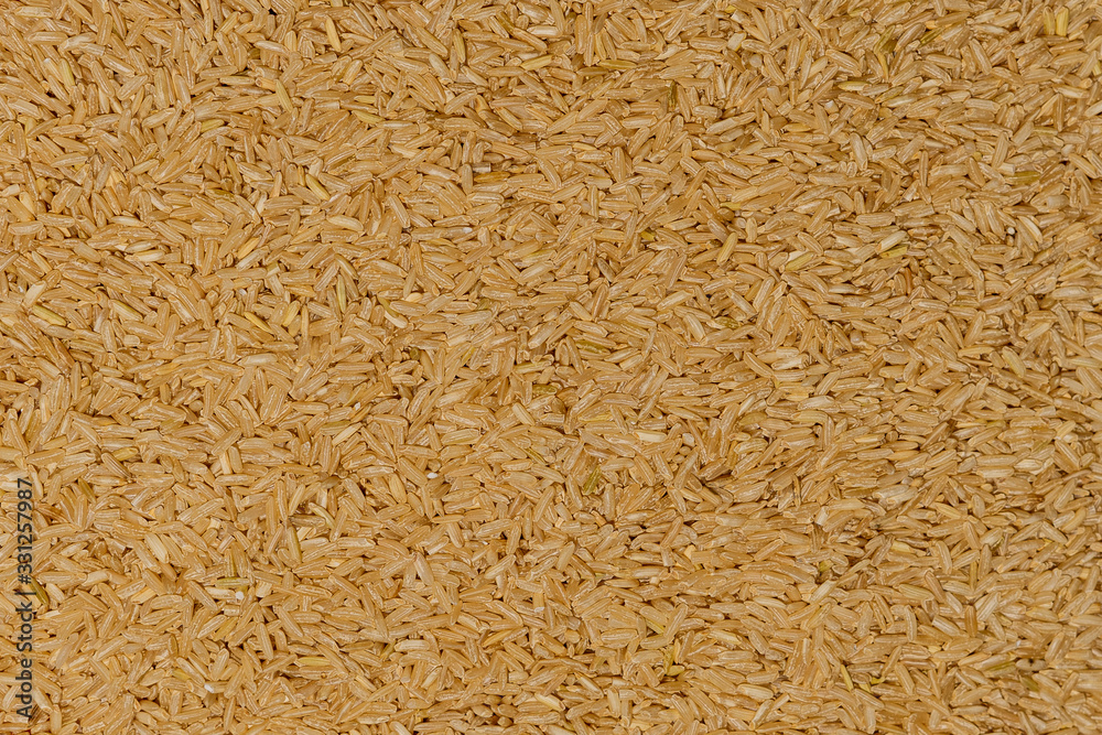 Brown rice background, raw rice for proper nutrition Brown rice background, raw rice for proper nutrition