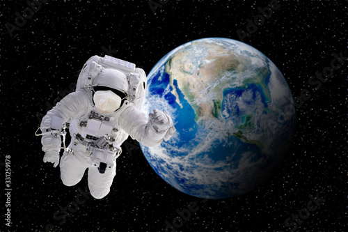 CORONA Virus in Healthcare Concept : Astronaut floating in space and wear protective masks to protect CORONA virus with blue planet earth in background. (Elements of this image furnished by NASA)