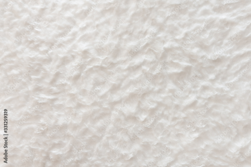 White real wool with a white top texture background, light natural sheep wool, white seamless cotton, fluffy fur texture for designers, close-up white wool rug White real wool with a white top texture background, light natural sheep wool, white seamless cotton, fluffy fur texture for designers, close-up white wool rug