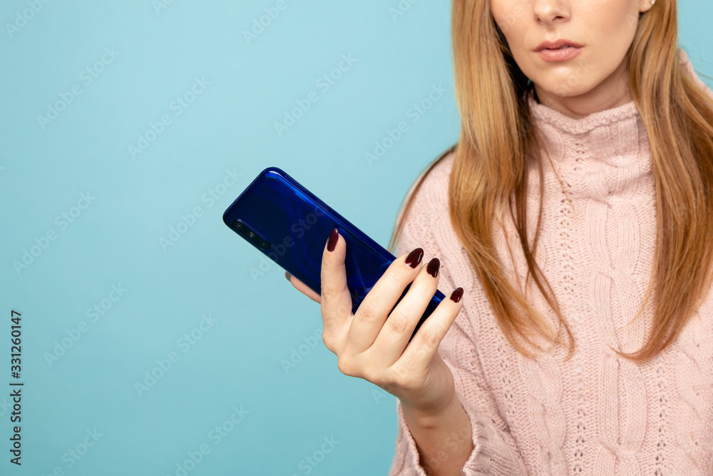Closeup picture of woman holding phone isolated Closeup picture of woman holding phone isolated