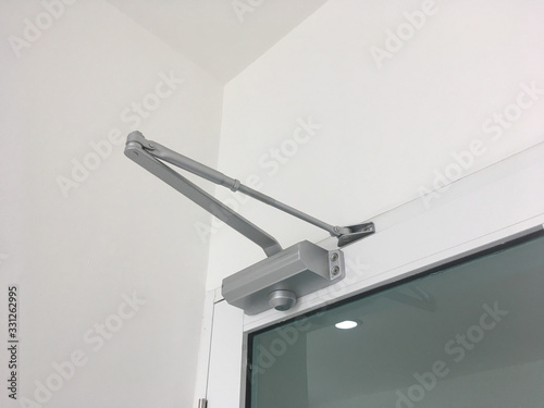 automatic system hydraulic ,leaver hinge modern glass door closer holder. photo