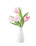 spring flowers in white vase isolated on white wooden background