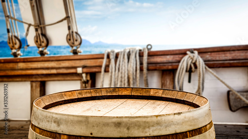 Fototapeta Naklejka Na Ścianę i Meble -  Wooden desk of free space for your decoration and blurred ship deck.Summer sea and blue sky. 