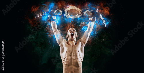 Boxer with champion belt celebrating flawless victory isolated on black background with copy Space..