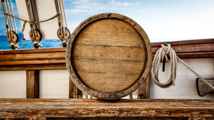 Plexiglas schilderij Schip Houten tafel met uitzicht op zee  © magdal3na
