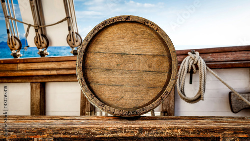 Fototapeta Naklejka Na Ścianę i Meble -  Wooden desk of free space for your decoration and blurred ship deck.Summer sea and blue sky. 