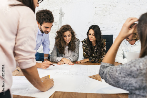 Group of young experienced people meets in a meeting on the progress of a building project - Millennials during a refresher lesson - Training course concept
