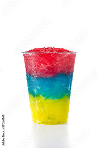 Colorful slushie with different flavors isolated on white background photo