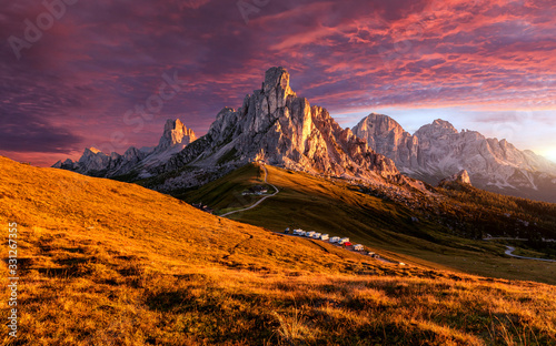 Beautiful alpine highlands with dramatic sky. Incredible view in Dolomite Alps. Awesome nature Landscape. View from Passo Giau on Ra Gusela peak under sunlight during sunrise. Dolomites alps, Italy,