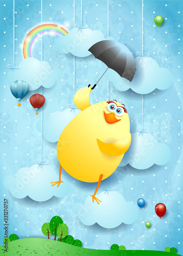 Funny flying chick with umbrella on surreal background