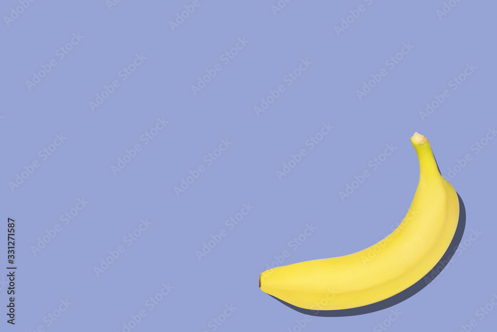 Sweet bananas on the blue background with copyspace Sweet bananas on the blue background with copyspace