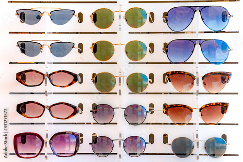 Stand with many sunglasses in a store of optics
