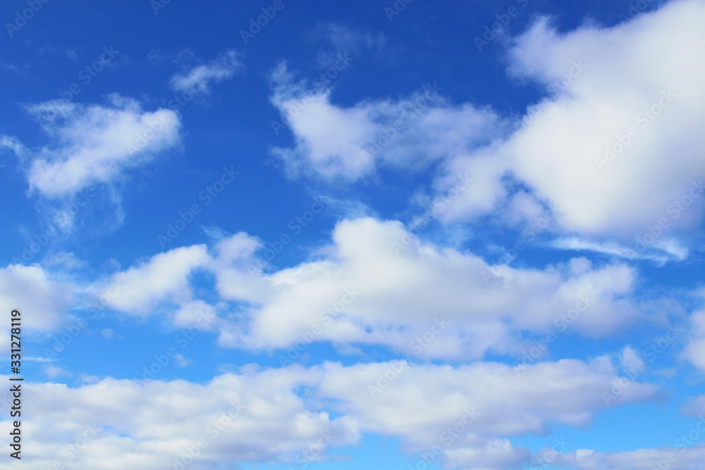 Fototapeta premium Beautiful blue sky and white cumulus clouds. Background. Scenery.