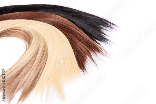 Long hair extensions in natural colors. Black, brown, blonde, and blonde balayage. photo