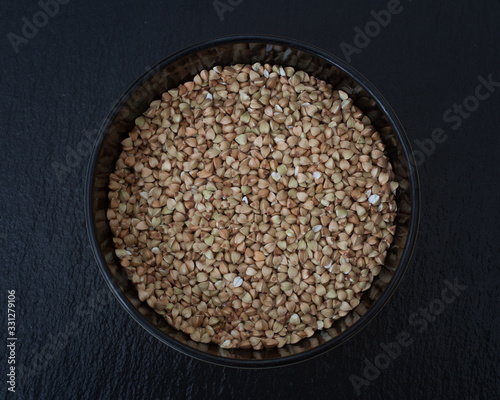 Buckwheat photographed against a black background