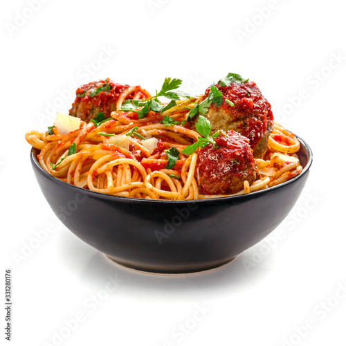 Pasta with meatballs, parmesan and tomato sauce in a clay bowl. Homemade Italian spaghetti isolated on white background.