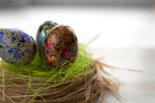 Galactic Easter eggs in a nest on a gray background, top view,. Selective focus