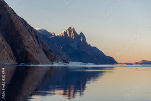 Beautiful landscape with iceberg in Greenland at summer time. Sunny weather. © Alexey Seafarer