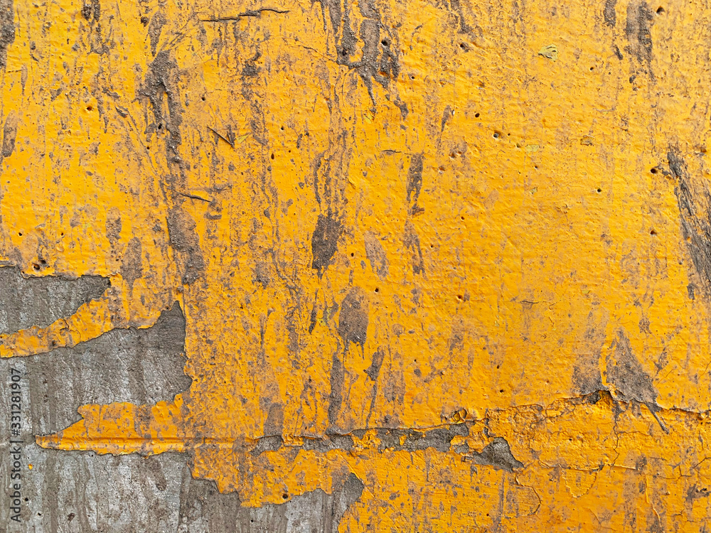 Peeling paint on wall seamless texture. Pattern of rustic Yellow grunge material.