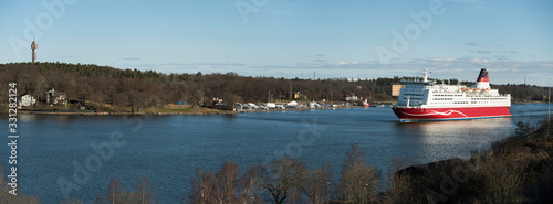 Ferry arrive to Stockholm from Finland after cruising in the archipelago photo