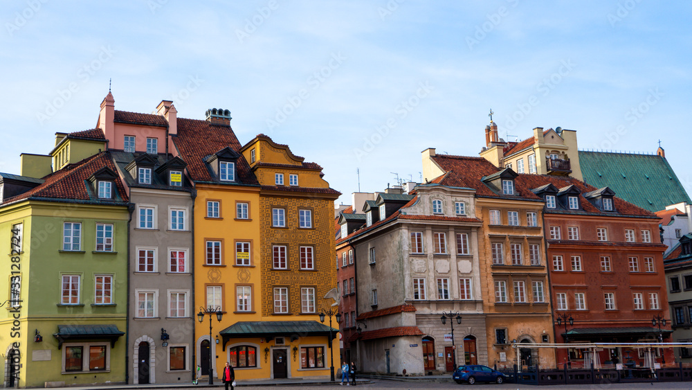 Warsaw, Poland - 18/ 03/ 2020:. Beautiful multi-colored houses in the old town in Warsaw. The central streets of the historic center of Warsaw. The main tourist attraction of Warsaw. 