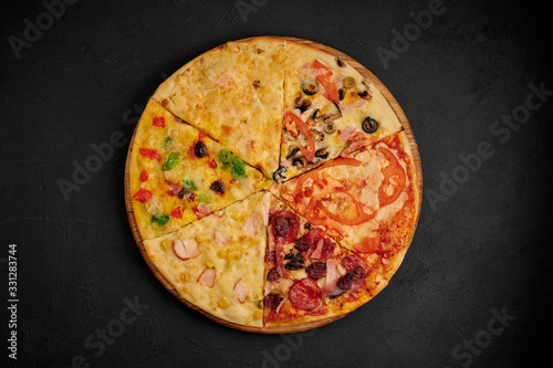 pizza on a black background, assorted in one pizza, assorted pizza