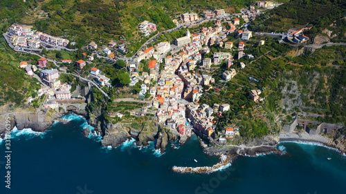 Riomaggiore Cinque Terre is a traditional and colorful fishing village near a cliff on the Mediterranean Sea, located on the Ligurian coast in Italy.  © Fly_and_Dive
