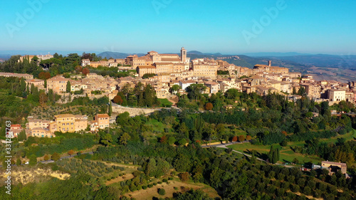 Authentic village of Montepulciano. A beautiful old town with red roofs in Tuscany, Italy. Perfect for travels and vacations - aerial view with a drone	