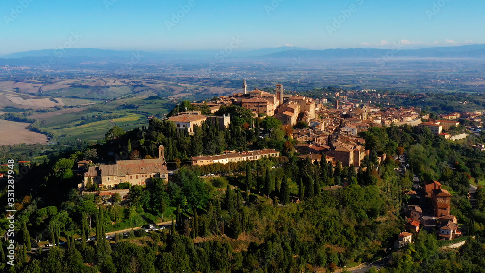 Village of Montepulciano with wonderful architecture and houses. A beautiful old town in Tuscany, Italy. Perfect for travels and vacations - aerial view with a drone