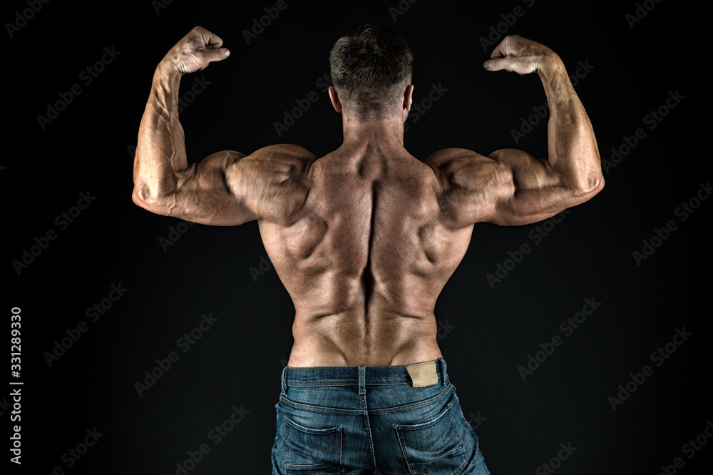 Grow strong. Bodybuilder flex arms back view. Sports coach black background. Sportsman show biceps triceps. Taking sports to stay in shape. Physical training and sports. Sports gym or club