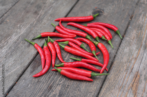 red chili peppers on wooden table