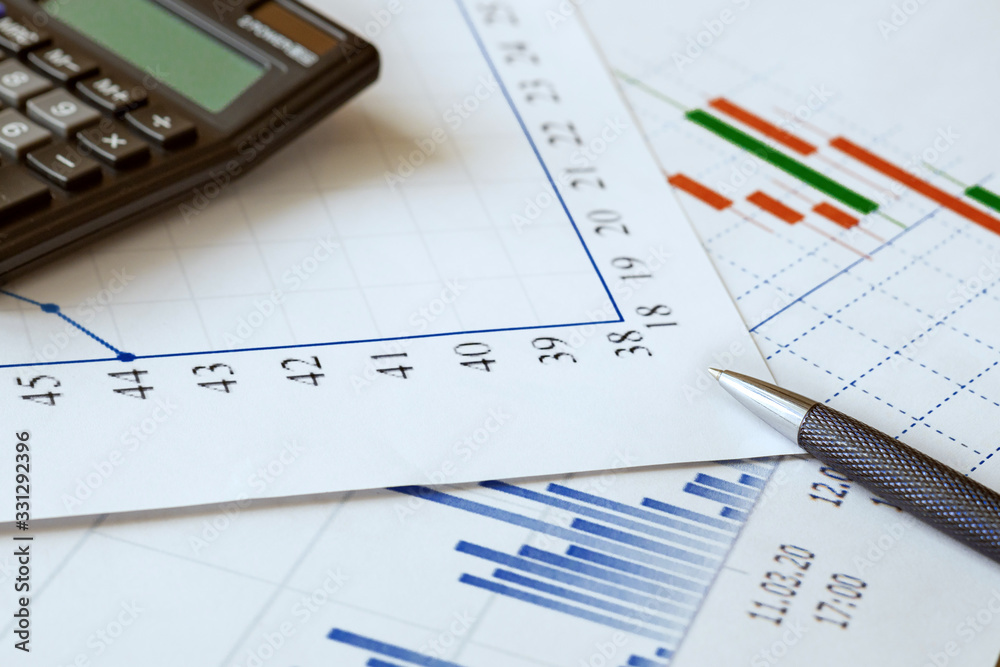 charts, calculator and pen as concept stock analytics, statistics for planning, financial instruments and banking crisis charts, calculator and pen as concept stock analytics, statistics for planning, financial instruments and banking crisis