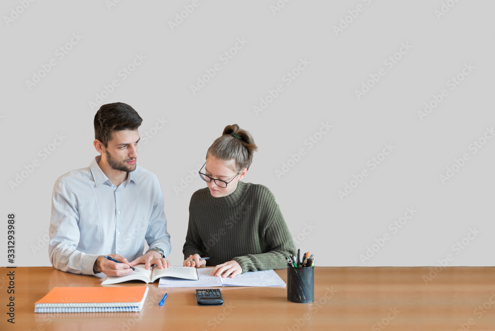 Student private lessons with teacher, speaking about the difficulties on the textbook. White space in background to write text. Student private lessons with teacher, speaking about the difficulties on the textbook. White space in background to write text.