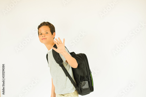 Young happy boy going to school