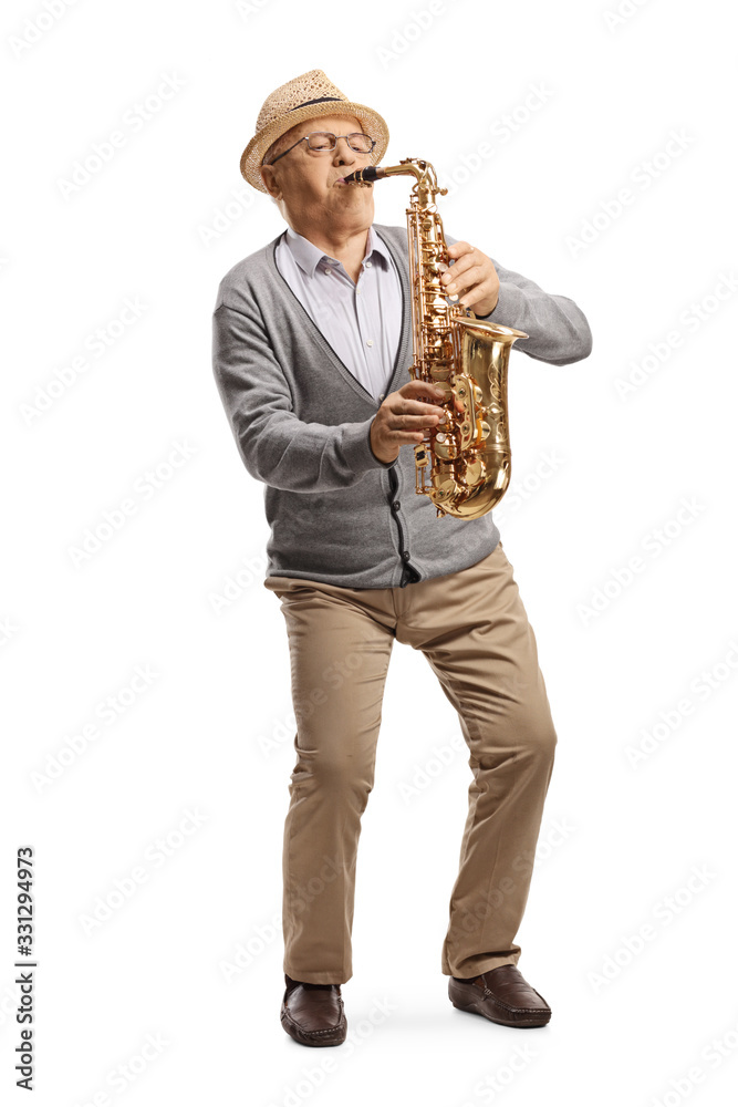 Naklejka premium Full length portrait of an elderly musisican playing a saxophone