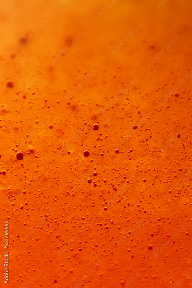 sweet orange effervescent bubble fizz. Macro close up photography. Full frame lemonade with selective focus