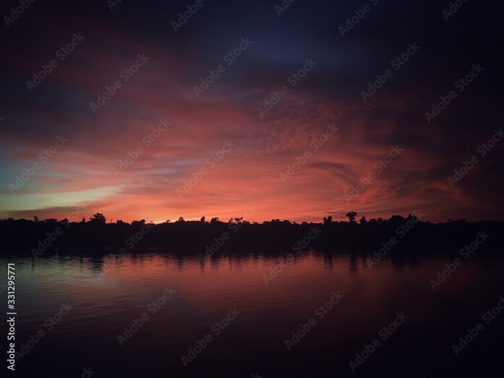 twilight scenery ( senja ) on the digul river - papua indonesia