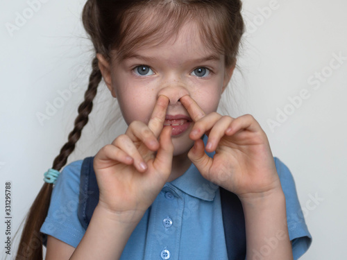  little school girl picking her nose, bad habits of children
