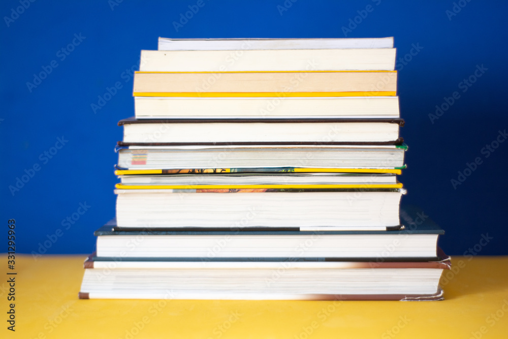 Group of books on a blue background. Concept: reading, literature and education Group of books on a blue background. Concept: reading, literature and education