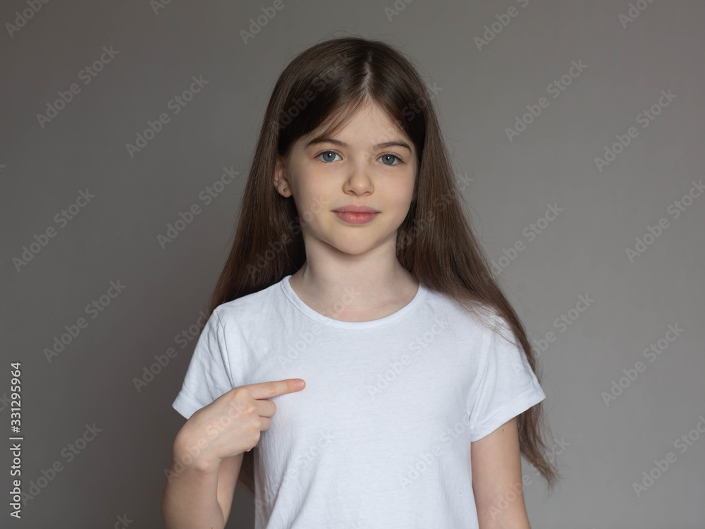Obraz premium young girl in a white T-shirt isolated on white background.Space for Your Text. 