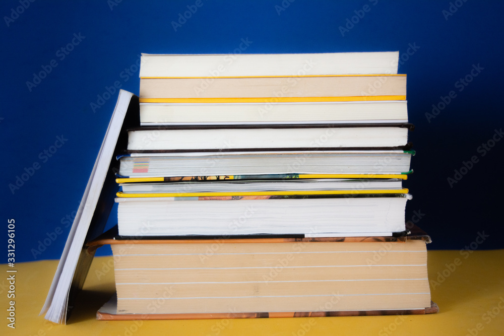 Group of books on a blue background. Concept: reading, literature and education Group of books on a blue background. Concept: reading, literature and education