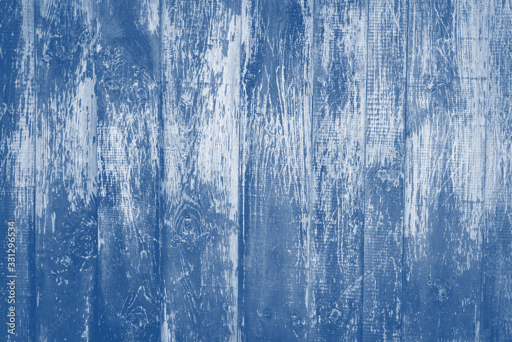 old rustic wooden background  toned in trendy color 2020 year classic blue.