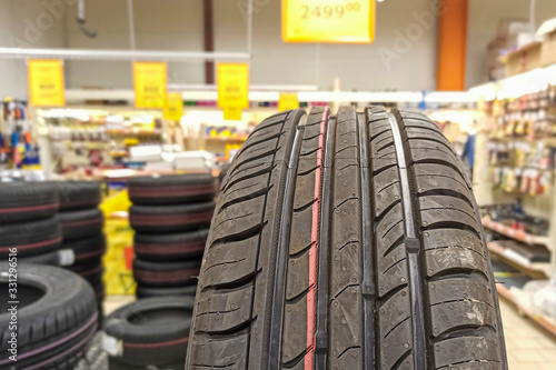 Summer tire close up. Sale of tires in a supermarket. Tire texture of car tires.