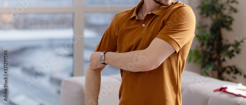 Casual man in polo blank t-shirt. Standing in live room shirt for you mockup photo